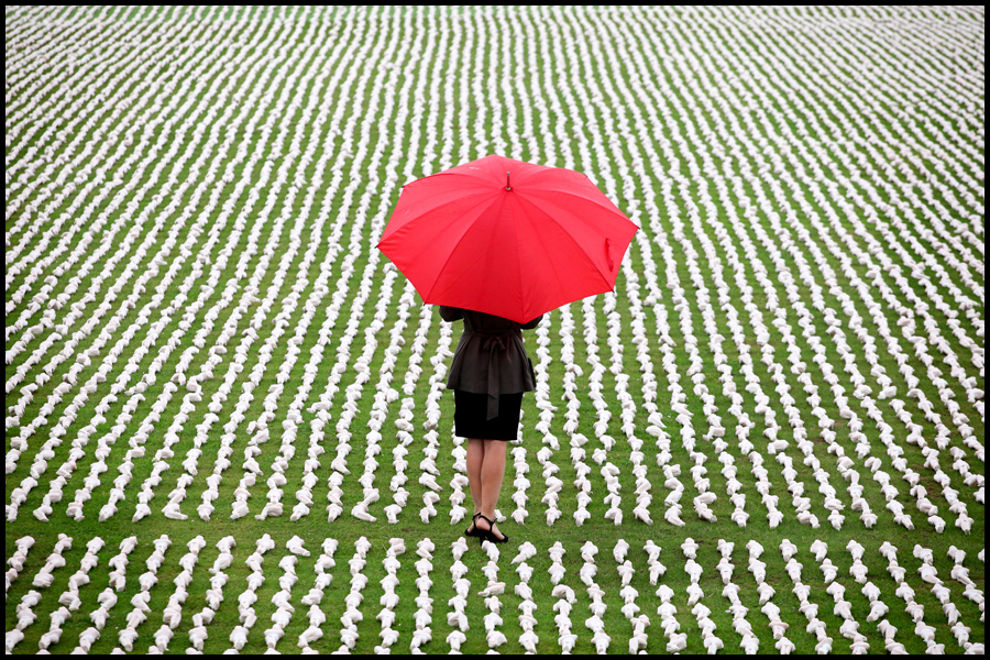 A lonely figure is pictured against the Shrouds of the Somme by artist Rob Heard. Each figure is individually wrapped and represents one of the fallen 19240 soilders who died on the first day of the battle.